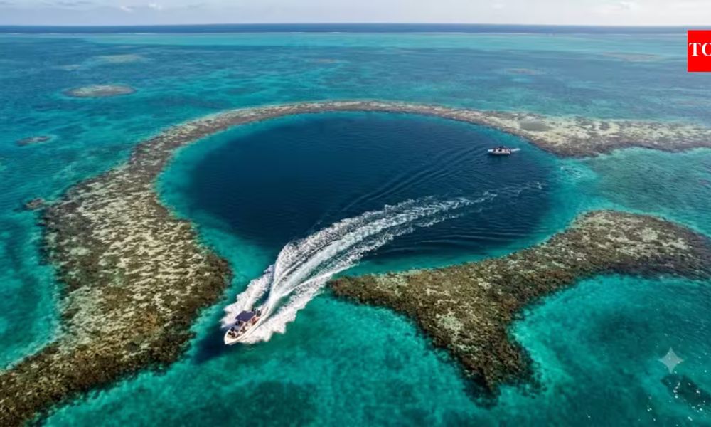 Belize Travel destination featuring the famous Great Blue Hole surrounded by turquoise Caribbean water